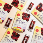 Multiple packages of oom Oral Zen on a light background